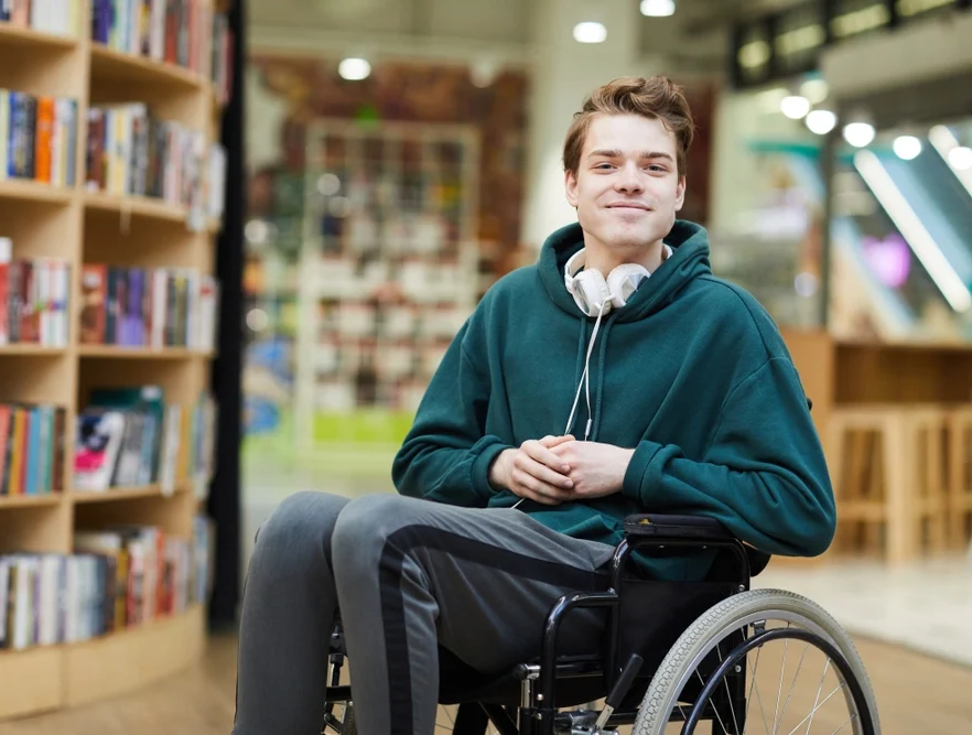 disabled men on wheelchair in a library